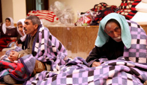 People from the minority Yazidi sect take refuge in a building in Shikhan January 19, 2015. Islamic State has hounded ethnic and religious minorities in northern Iraq since seizing the city of Mosul in June, killing and displacing thousands of Christians, Shi'ite Shabaks and Turkmen who lived for centuries in one of the most diverse parts of the Middle East. Hundreds of Yazidi women and girls have been captured, raped and tortured, and forced to convert to Islam and marry Islamic State followers, according to rights groups. The Yazidi are a religious sect whose beliefs combine elements of several ancient Middle Eastern religions. Tens of thousands have fled Islamic State fighters, who say the Yazidi must embrace their radical version of Islam or die. REUTERS/Ari Jalal (IRAQ - Tags - Tags: CIVIL UNREST CONFLICT RELIGION SOCIETY) - RTR4M21G
