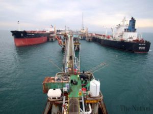 Oil tankers dock at a floating plattform offshore from the southern Iraqi port city of Al Faw