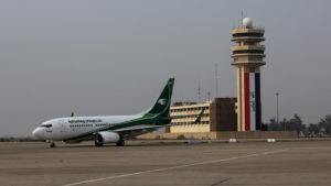 An Iraqi Airways plane arrives at Baghdad airport, Iraq, Tuesday, Jan. 27, 2015. Several airlines suspended flights to Baghdad on Tuesday after a passenger plane arriving from the Mideast's busiest airport in Dubai came under fire as it landed in the Iraqi capital. (AP Photo/Karim Kadim)