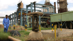 A worker walks between pipes at the oil and gas separation facility at the Baba Gurgur oil field in the Arafa district of Kirkuk, northern Iraq, Thursday, May 13, 2004. OPEC's plan to boost oil output may lower prices from near record highs, as long as members ensure rigs, pipelines and refineries are secure, said analysts and traders including Clay Smith of Commerzbank Securities. Photographer: Staton R. Winter/Bloomberg News