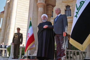 Iraqi President Barham Saleh (R) shakes hands with his Iranian counterpart Hassan Rouhani upon his arrival at the Presidential palace in Baghdad on March 11, 2019. - Iran's President Hassan Rouhani arrived in Iraq for his first official visit, as Baghdad comes under pressure from Washington to limit political and trade ties with its neighbour. (Photo by SABAH ARAR / AFP) (Photo credit should read SABAH ARAR/AFP/Getty Images)